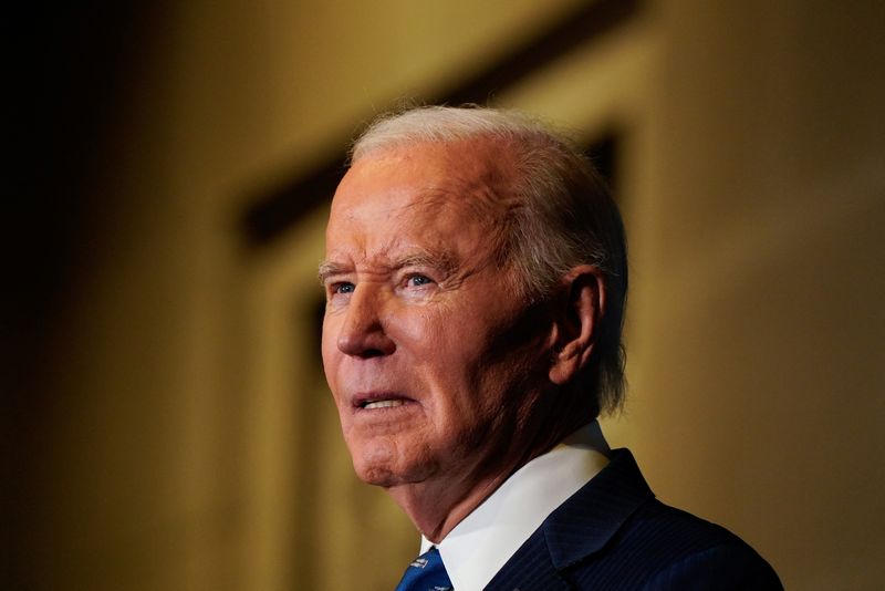 Biden hails economic record, warns against Republican return to 'trickle-down economics'