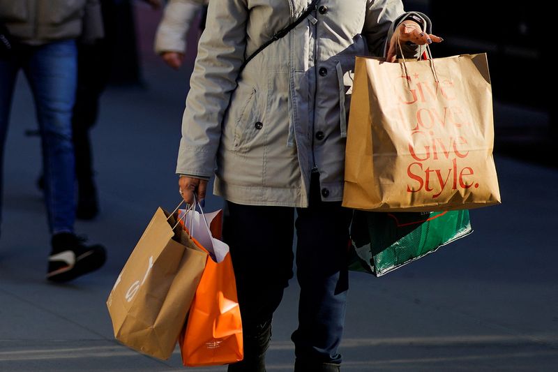 US consumer spending rises in November; monthly inflation benign