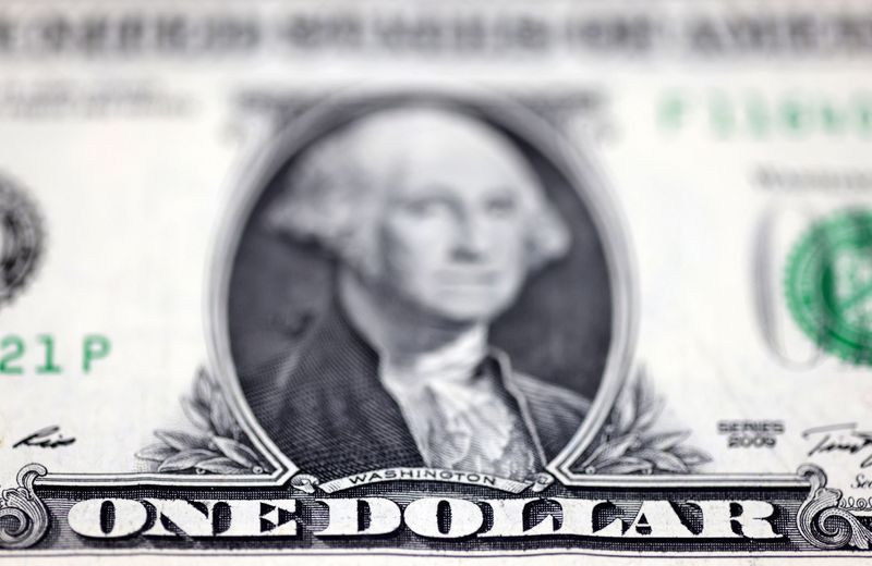 Dollar holds onto gains ahead of US jobs data; sterling slips