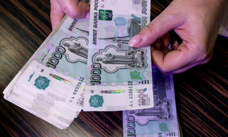 Russian rouble slips as oil price and forex action limit sanctions impact